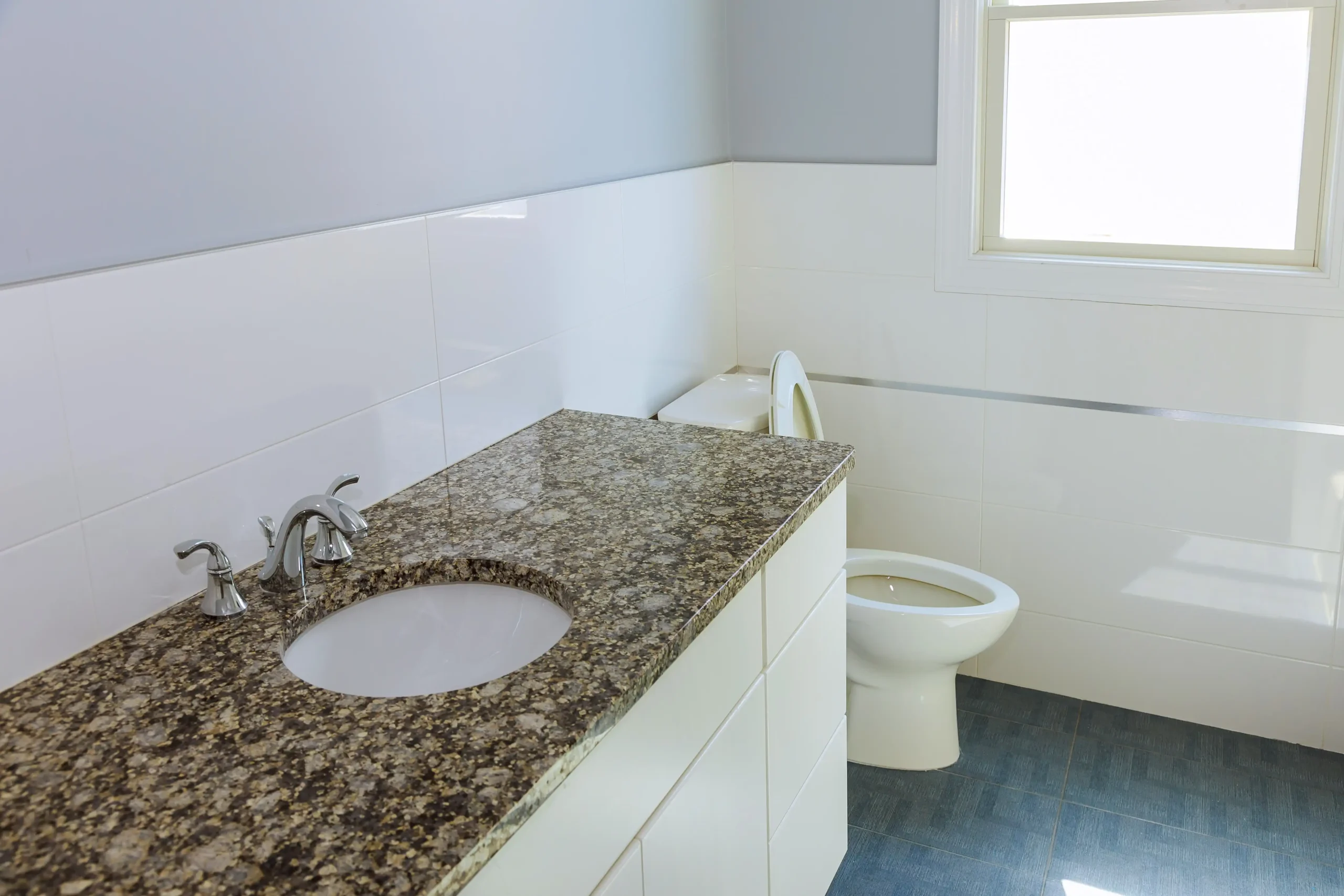 new-modern-bathroom-with-beige-tiles-and-brown-cab-2026-01-05-23-59-48-utc